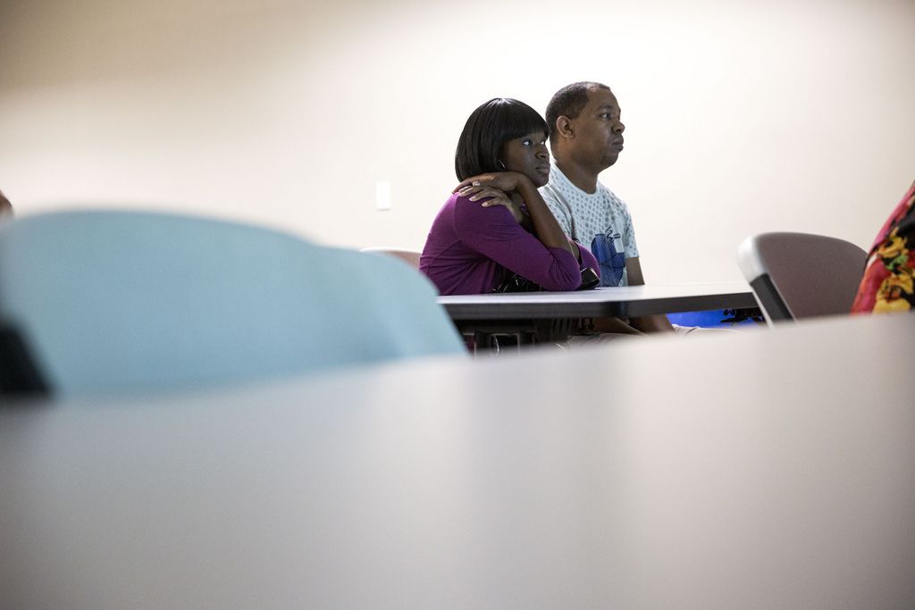 Phillips and Barnett attend an orientation session on public housing at the Housing Authority of the City of Austin.
